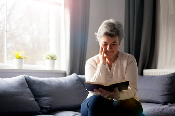 istock senior woman with Bible 901488656
