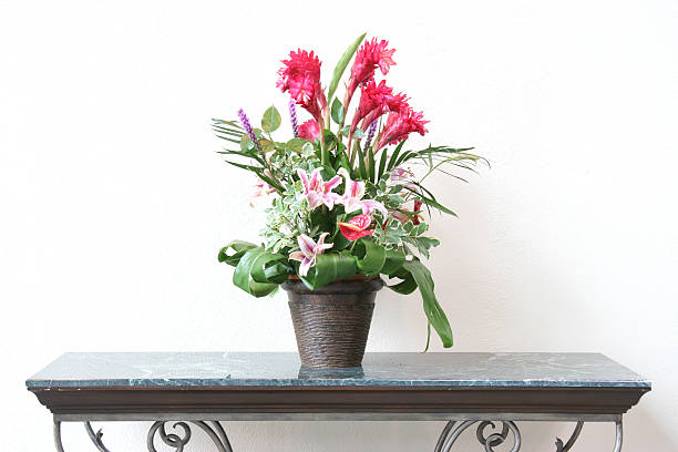 istock Beautiful flowers in metallic vase on marble table 90149356