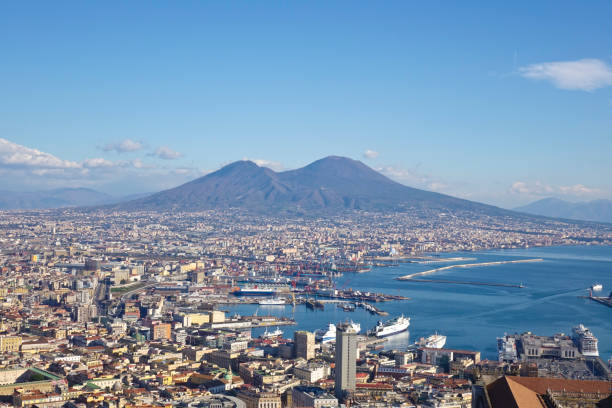 istock Vesuvio and Naples waterfront with rocks and boats 901494084