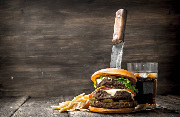istock Big burger with cola and fries. 901494242