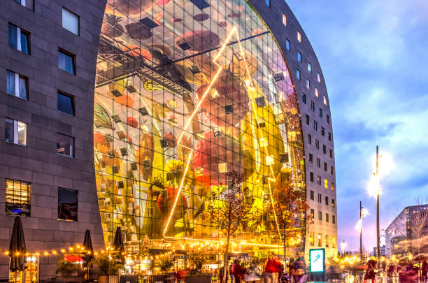 Light decoration in the shape of a large Christmas tree on the glass facade of the Markthal in Rotterdam