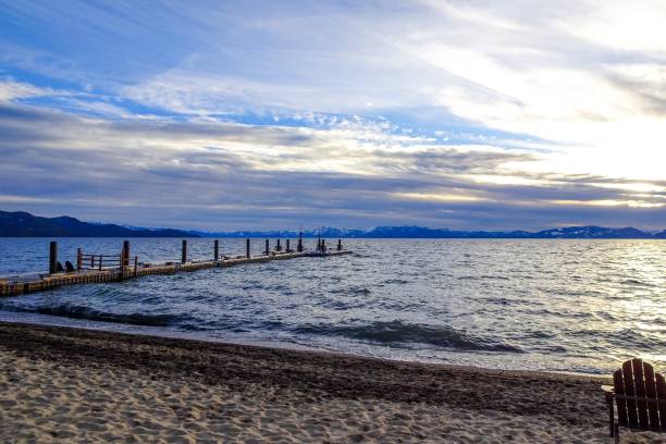 istock Lake Tahoe Sunset and chairs on beach 901497022