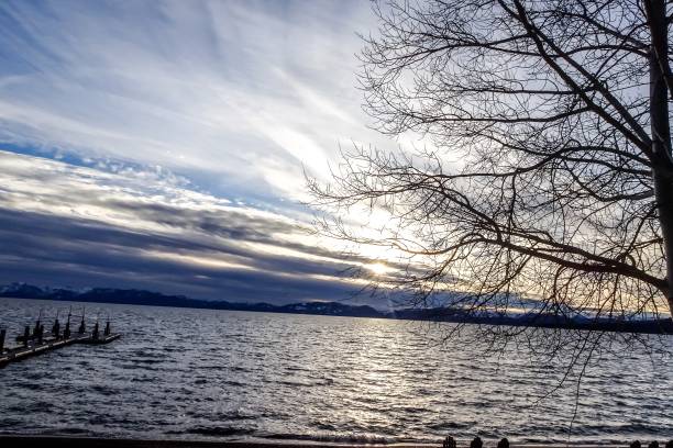 istock Lake Tahoe Sunset and chairs on beach 901497082