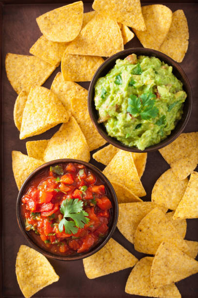istock mexican guacamole and salsa dip, nachos tortilla chips 901497772