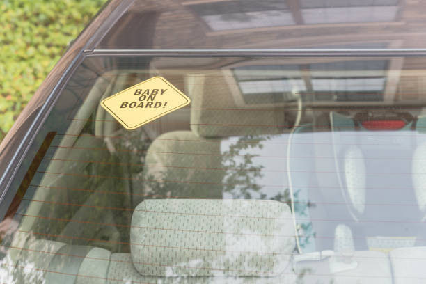 istock Baby On Board sticker on the car back windows 901500184