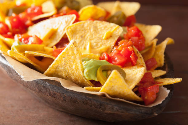 istock nachos loaded with salsa, guacamole, cheese and jalapeno 901505338