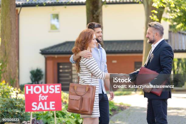 Seller Congratulating Couple Buying House Stock Photo - Download Image Now - House, Selling, Real Estate Agent