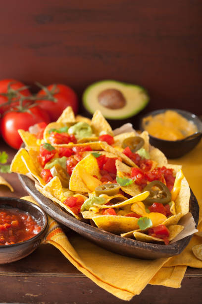 istock nachos loaded with salsa, guacamole, cheese and jalapeno 901505614