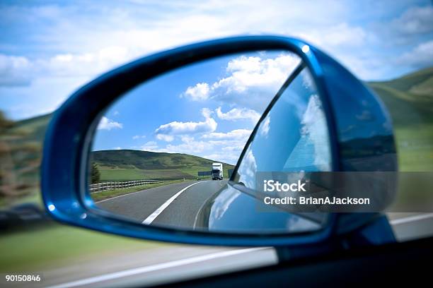 Rear View Mirror On Road Showing Semi Truck Stock Photo - Download Image Now - Rear-View Mirror, Truck, Agricultural Field