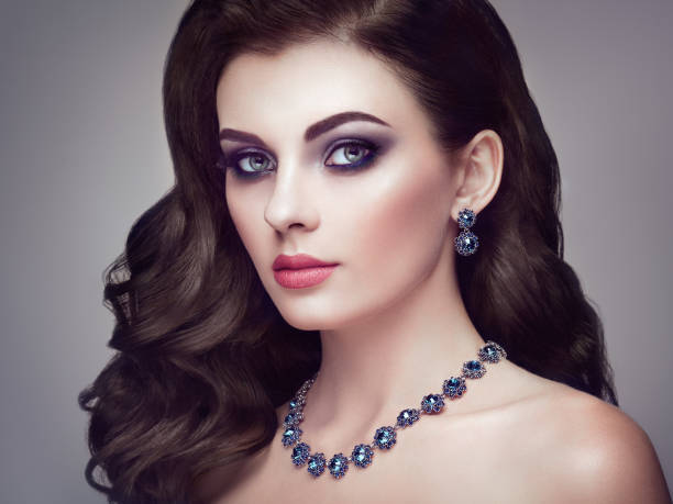 istock Brunette woman with long shiny wavy hair 901510370