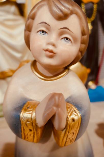 istock Wooden small  statue of praying angel 901510514