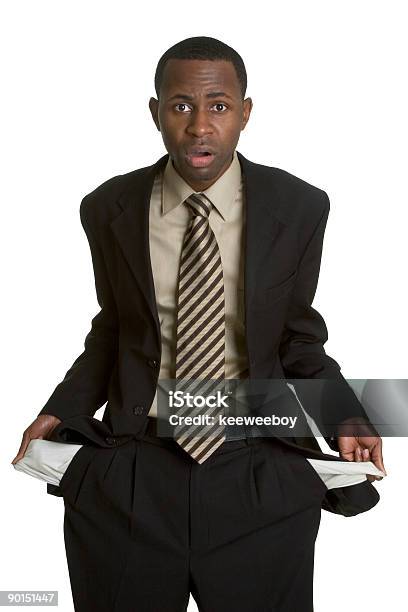 An African American Man Holding Out His Empty Pockets Stock Photo - Download Image Now