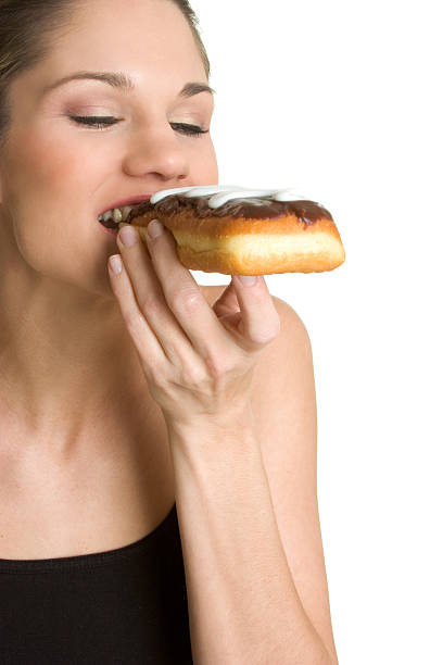 istock Girl eating donut 90151460