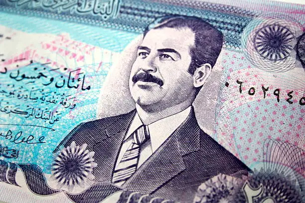 Saddam Hussein's mug on a 250 dinar bill.
