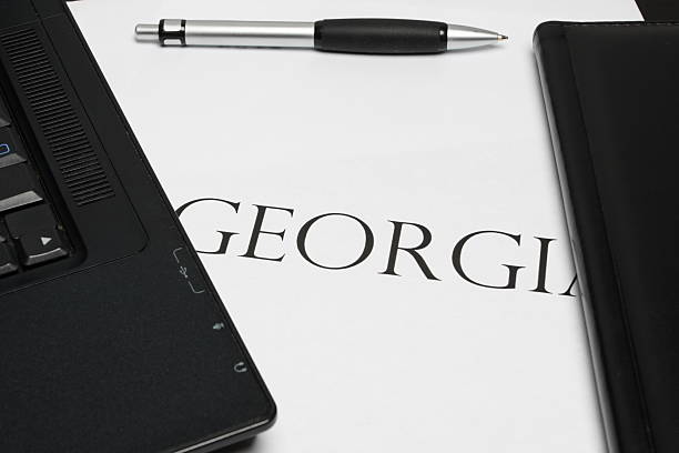 "georgia" word with laptop and pen stock photo