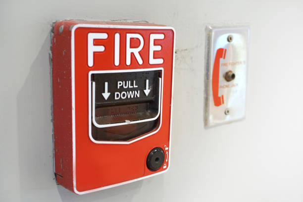 istock The red fire alarm and equipment on the white wall. 901527060