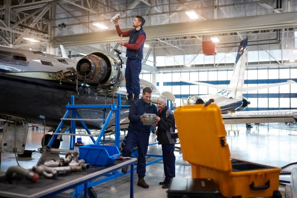 istock Aircraft mechanics in the hangar 901527332