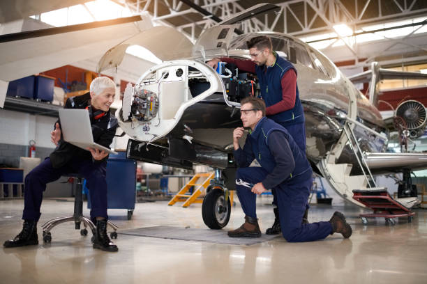 istock Aircraft mechanics in the hangar 901527514