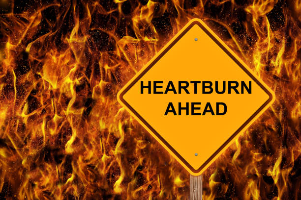 istock Heartburn Ahead Caution Sign With Flaming Background 901527960
