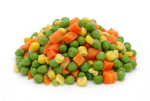 Frozen mixed vegetables in isolated white background