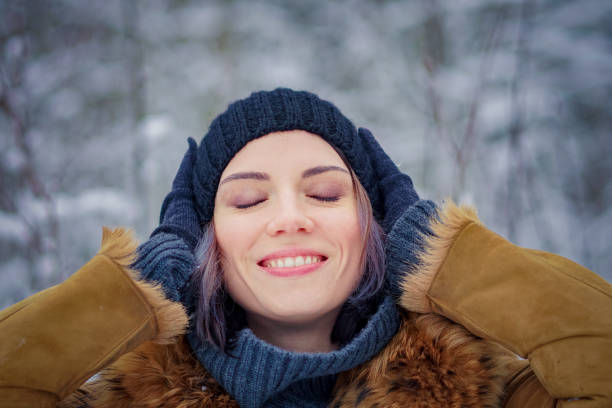 istock young beautiful girl posing in winter forest 901533640