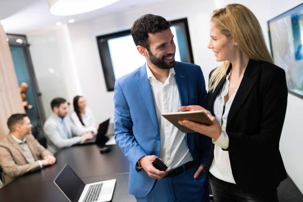 istock Attractive business couple using tablet in their company 901534008