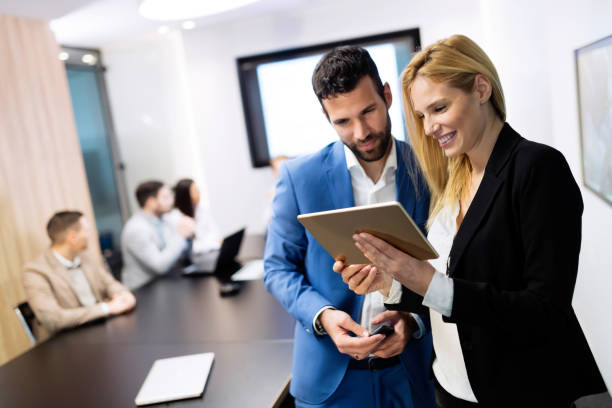 istock Attractive business couple using tablet in their company 901534248
