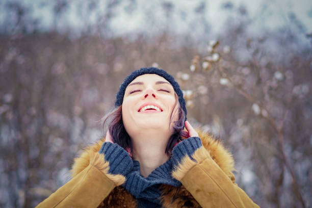 istock young beautiful girl posing in winter forest 901534324