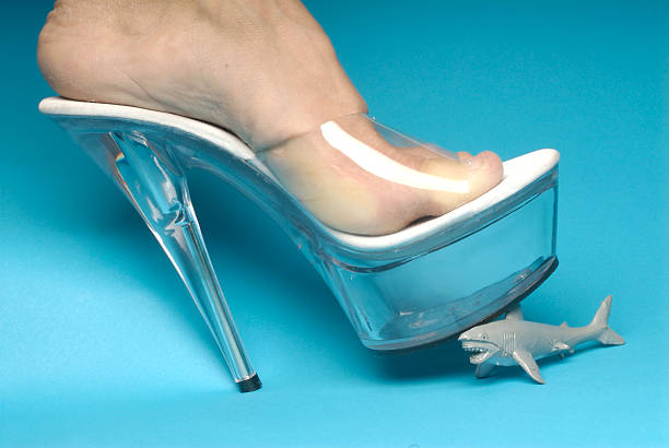 Woman examining her broken heel