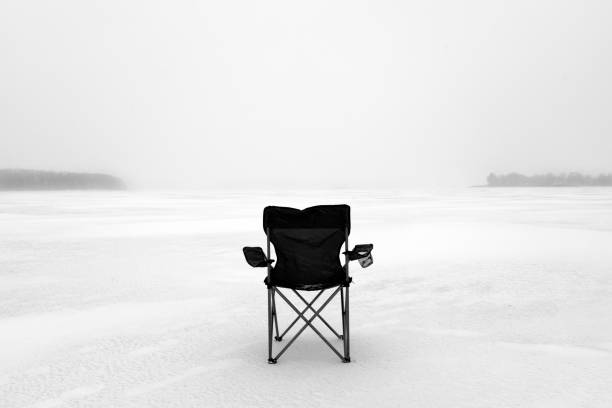 istock black chair stands in the snow 901535266