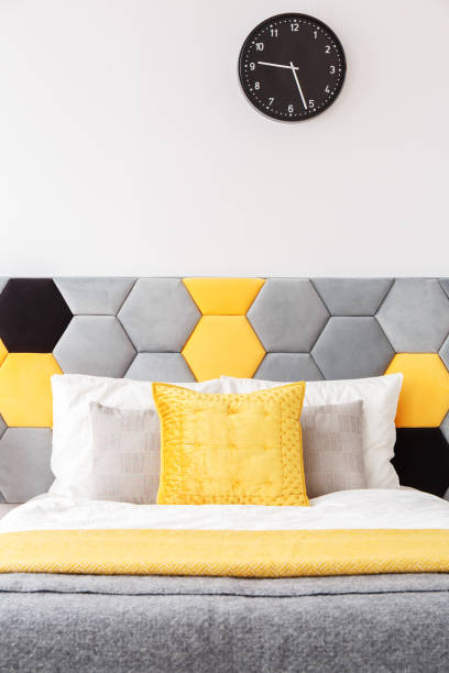 istock Close-up yellow pillow on bed 901535504