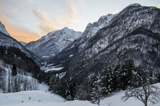 istock idyllic alpine snowy mountain view in sunset sky, Slovenia 901535752