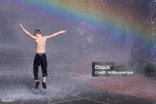 Childs Hot Summer Joy Under The Rainbow Stock Photo - Download Image Now - Dancing, Black Color, Cheerful