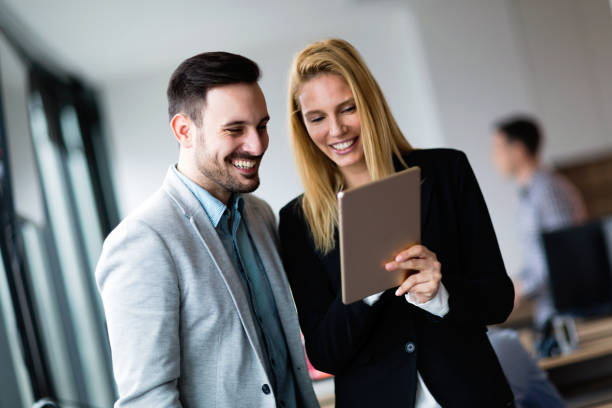 istock Attractive business couple using tablet in their company 901538572