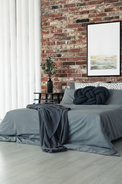 istock King-size bed in grey bedroom 901539168