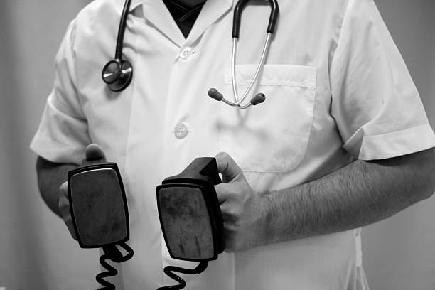 medical doctor holding a Electroshock stock photo