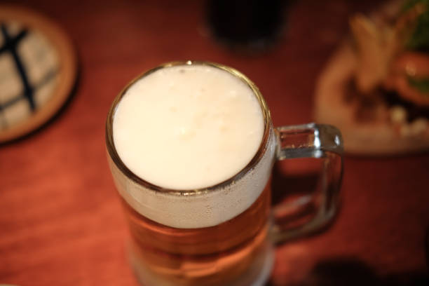 istock Beer in a glass with foam (selective focus) 901539542