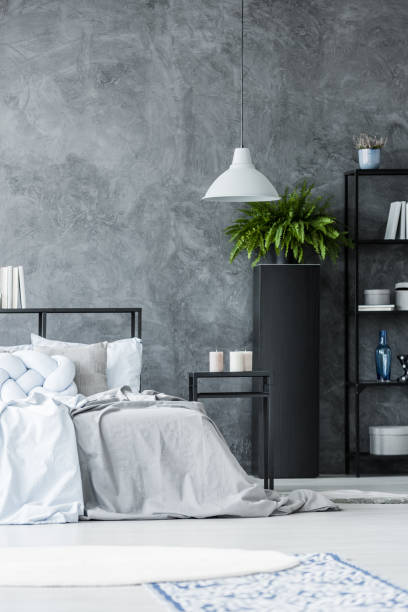 istock Grey lamp in monochromatic bedroom 901539830
