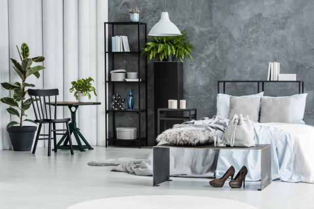 Black chair in bright bedroom
