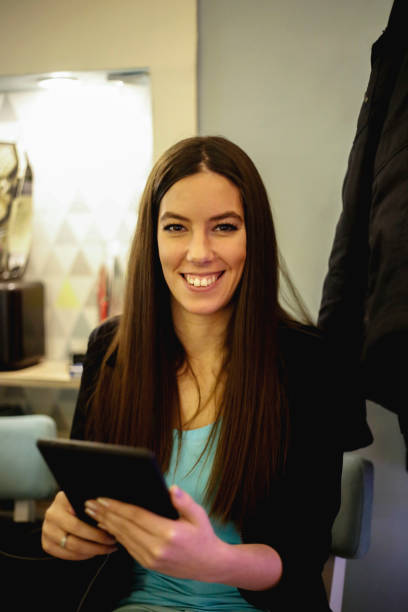 istock Handsome woman using digital tablet in a cafe 901542694