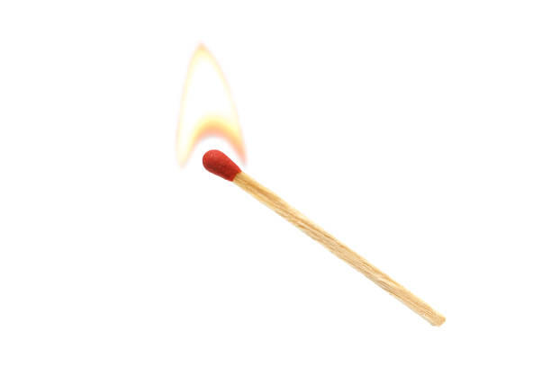 Burning match on a black background close up