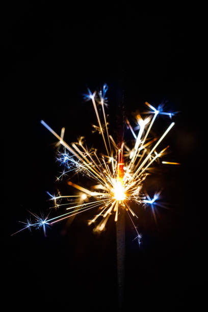 istock Burning sparkler isolated on black background blur 901543034