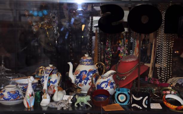 istock Objects shop showcase with many strange and vintage items. Selective focus. 901545750