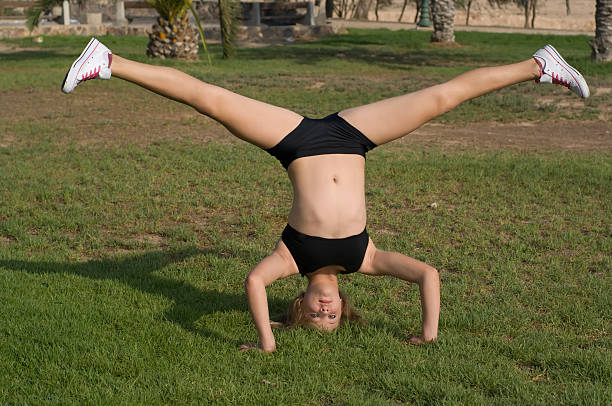 istock Young  girl exercising in the park 90154762