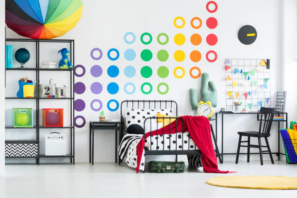 istock Kid's bed in rainbow bedroom 901558800