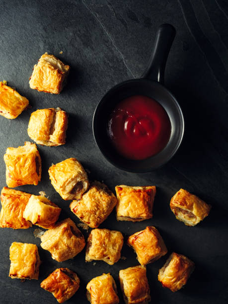 mini sausage rolls Home made freshness mini sausage rolls with Ketchup sausage roll stock pictures, royalty-free photos & images