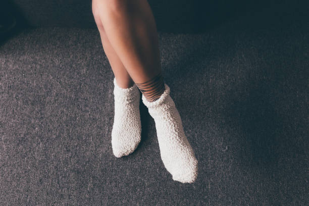 istock female legs in socks 901562830