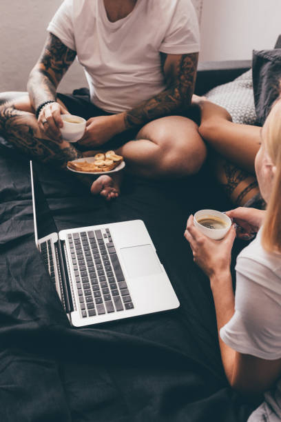 istock couple drinking coffee in bed in morning 901565758