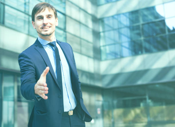 istock Smiling businessman standing outdoors 901566552