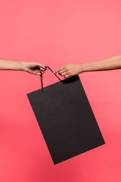 istock women holding shopping bag 901568172